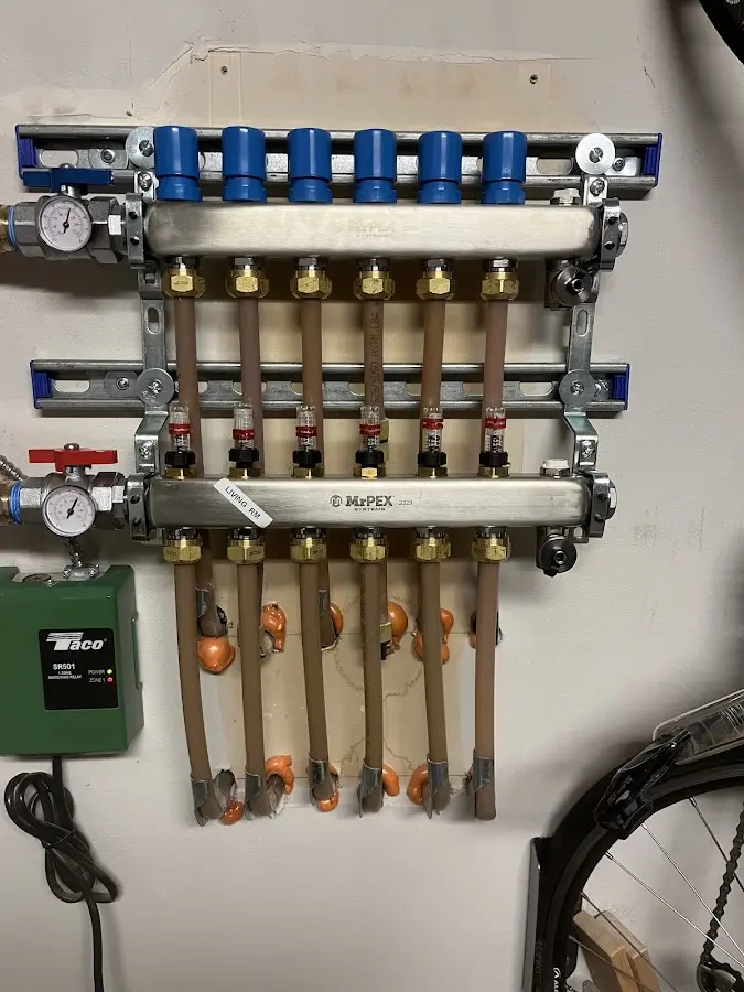 Plumber performing Water Heater Repair at a residential property in Sutherlin